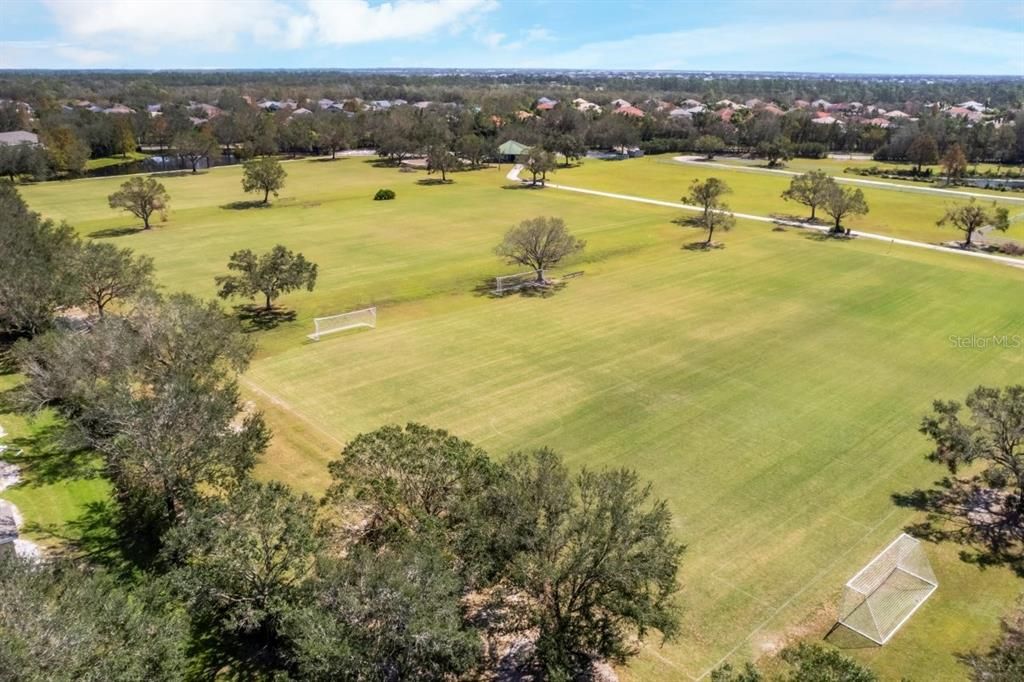 Sports fields and park located behind the home.