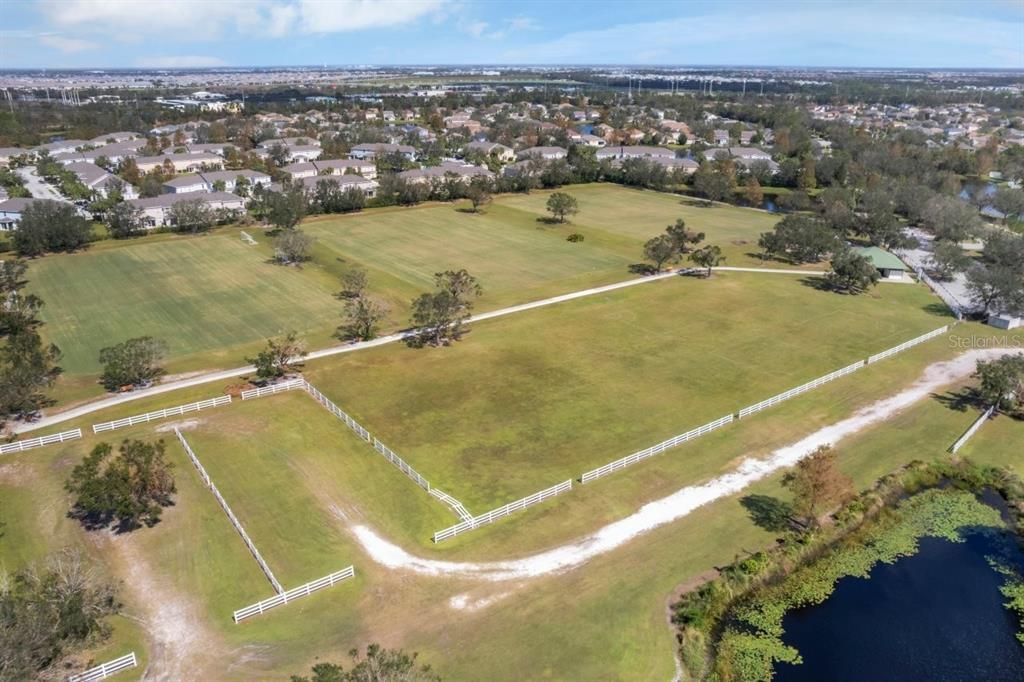 Sports fields and park located behind the home.