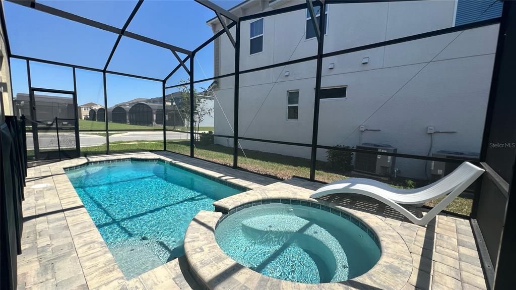 Outdoor enclosed pool and spa area