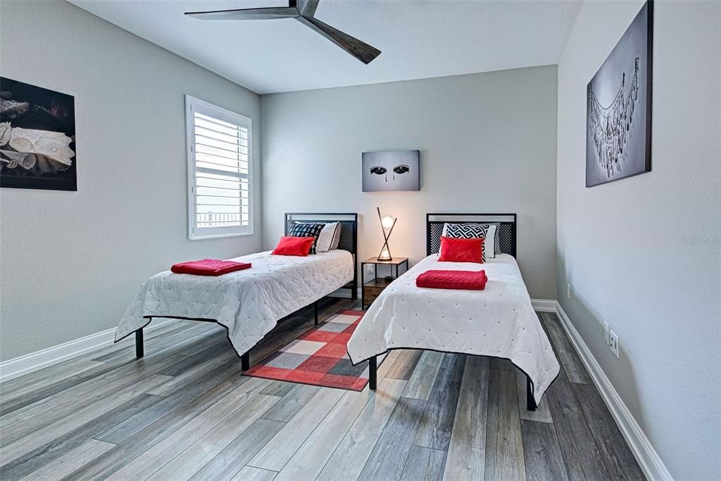 Split floor plan ensures guests have privacy to relax and recharge while luxury vinyl plank flooring, plantation shutters and modern fixtures/fans add class.