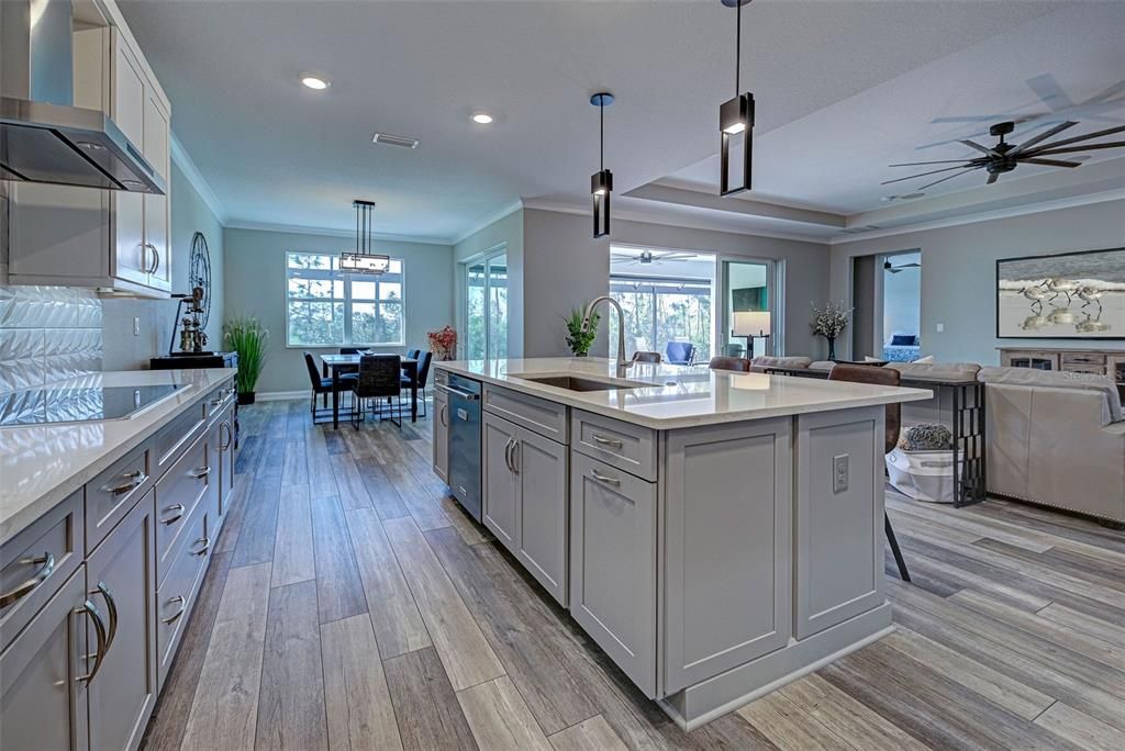 Owners spared no expense when designing the fabulous kitchen which features unique lighting and so much cabinet storage and prep space.