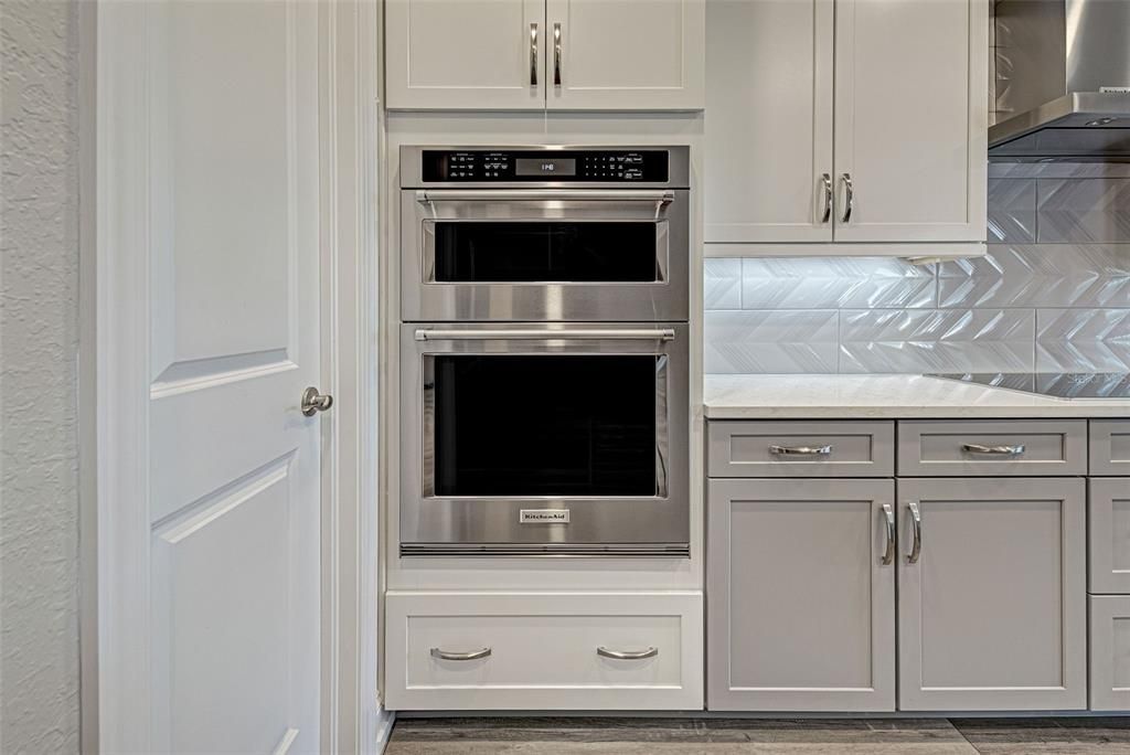 Gourmet kitchen offers undercabinet lights and even a walk-in pantry to meet all of your storage needs.