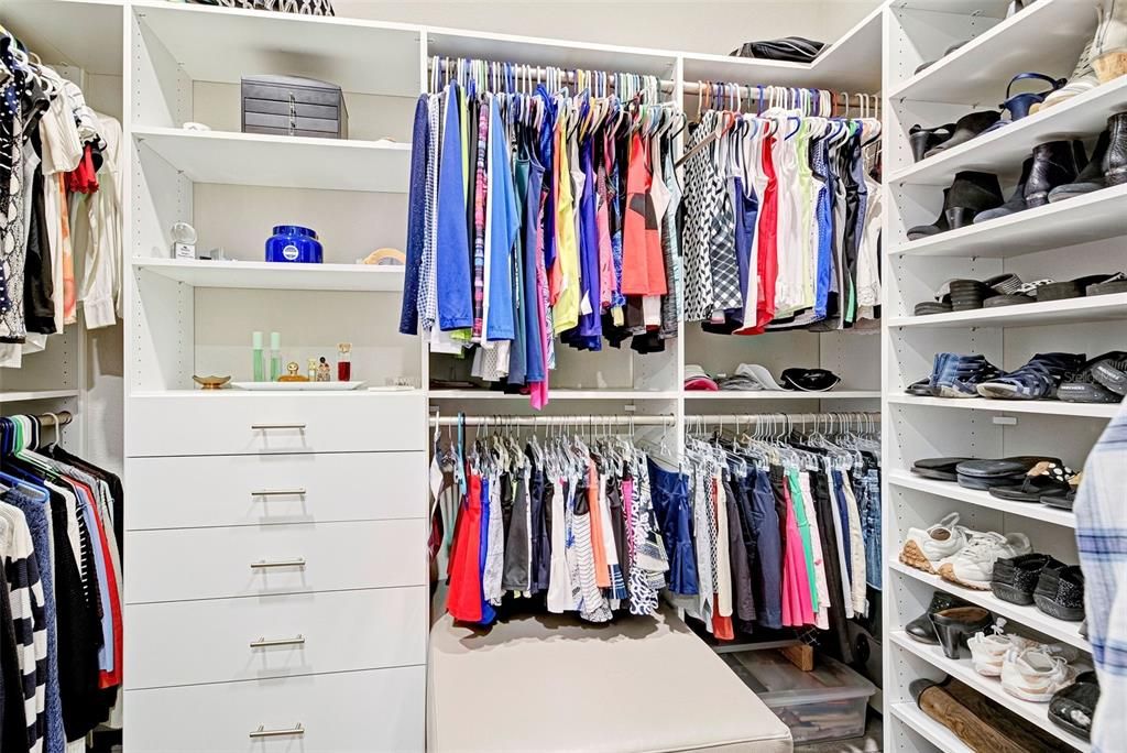 One of the two primary closets with custom shelving.