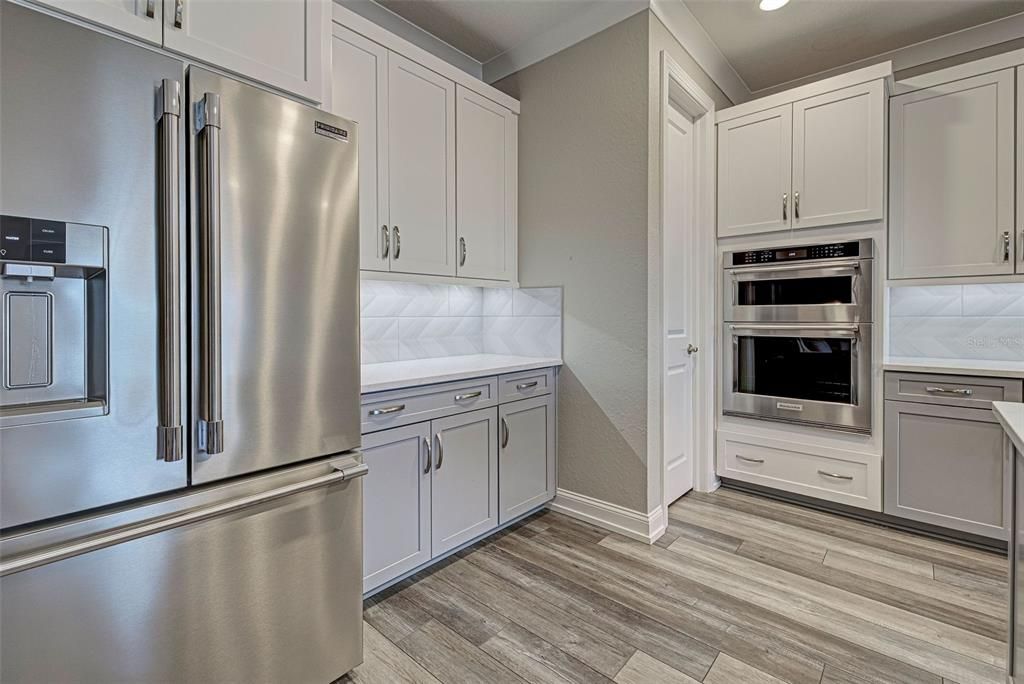 Upgrades include top of the line stainless steel appliances and 42" solid wood cabinets with soft close drawers.