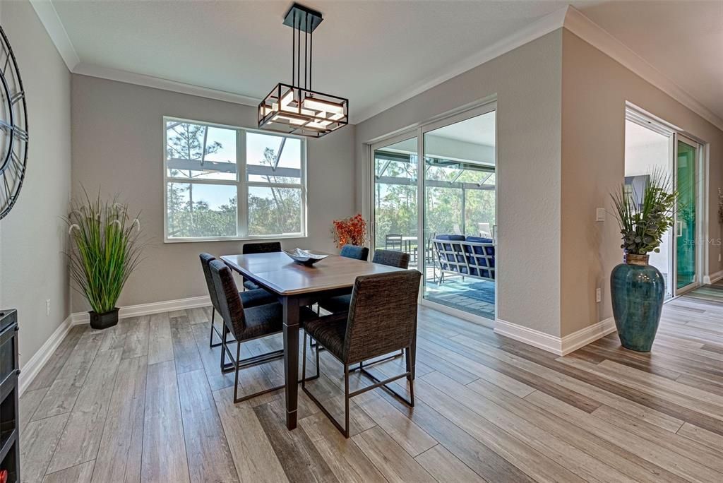 Large dining area has a convenient slider to the lanai, making entertaining a breeze.