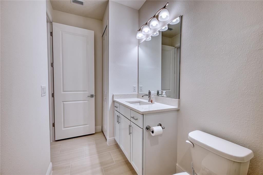 The main hall bath also has a linen closet.