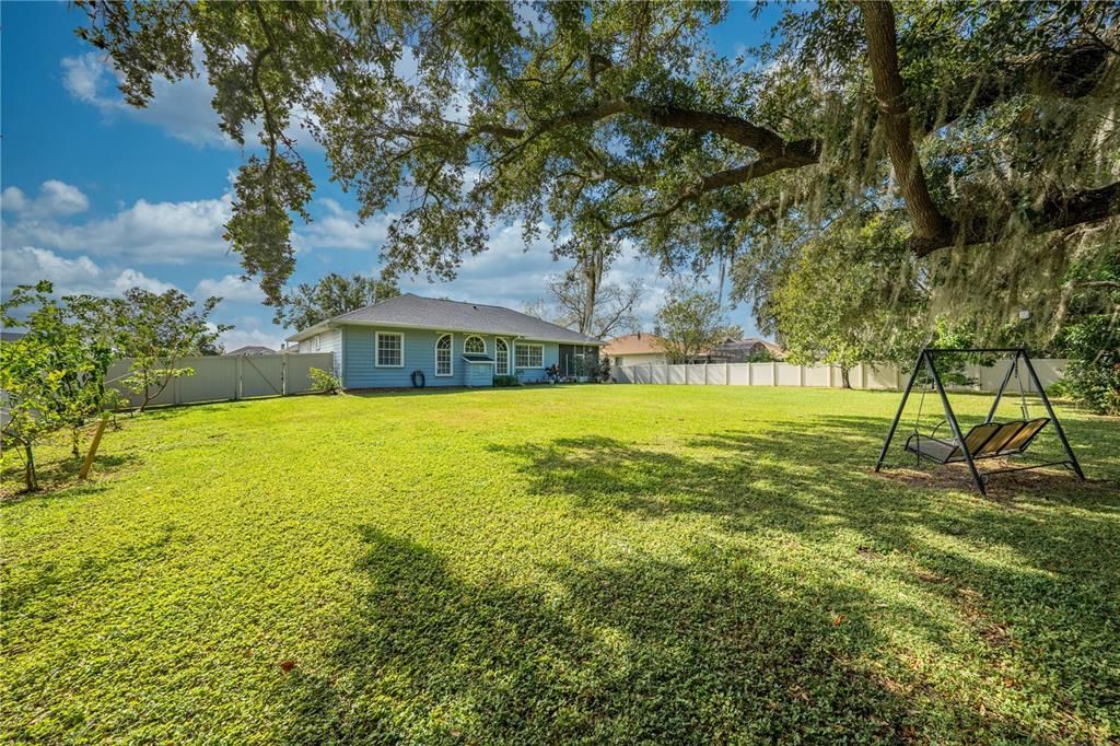 Parklike Backyard! Plenty of Room for a Pool! Workshop not shown in photo.