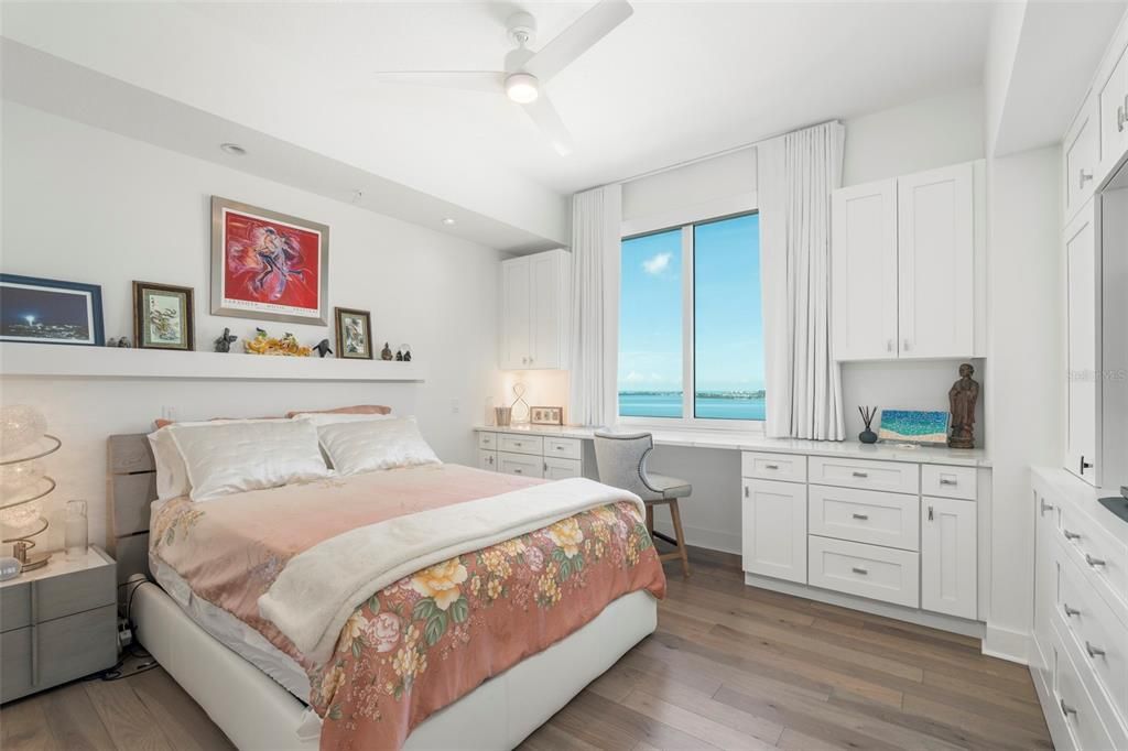 The guest bedroom with custom built-ins and ensuite bath