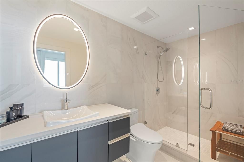 Guest ensuite bath with Cloudburst Concrete Caeserstone Quartz