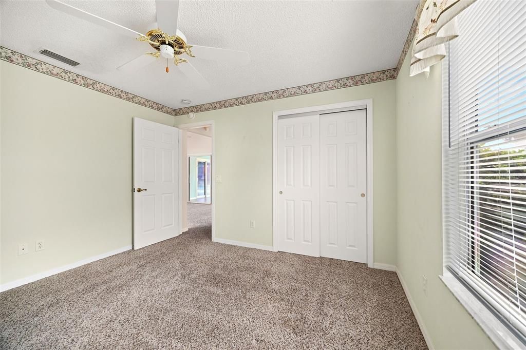 Guest bedroom with double door closet