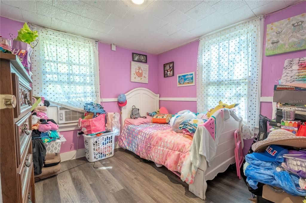 (Unit B) Bedroom 2 has laminate flooring and a built in closet.