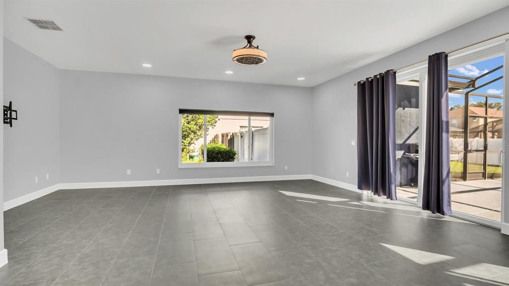 Family Room with new tile throughout the first floor.