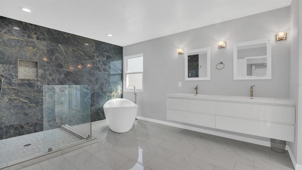 Primary renovated bathroom with dual sinks