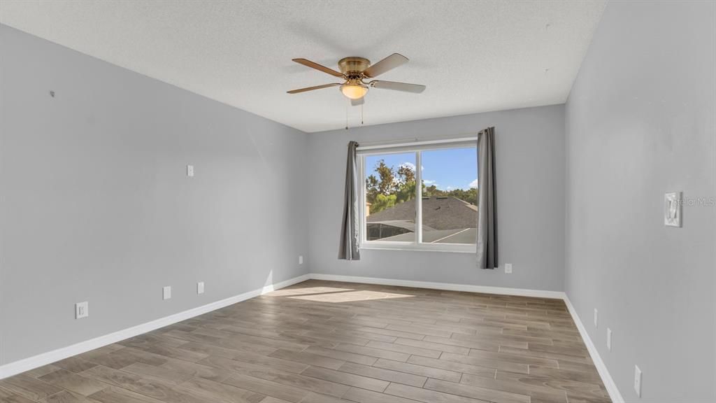 Loft area with new tile flooring and fan