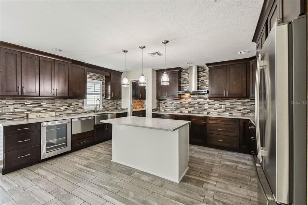 Beautiful backsplash throughout Kitchen, Built in Wine Cooler