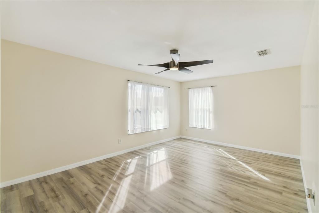 Bedrooms all with ceiling fans and engineered wood look flooring.