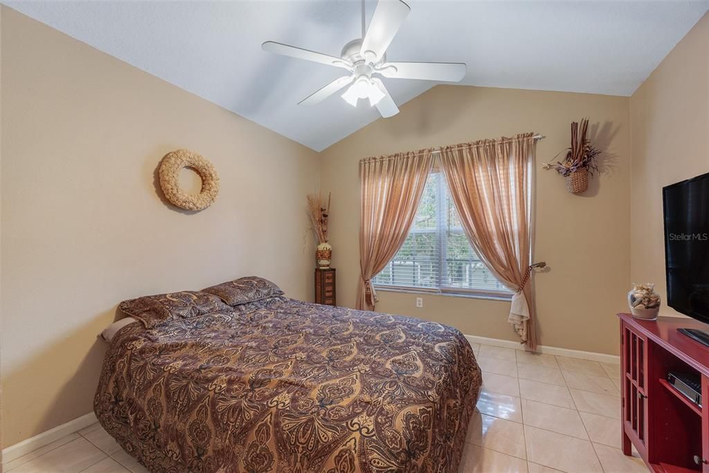 Bedroom #3 with porcelain tile is 11x11 and has vaulted ceiling and overlooks the front of the home.