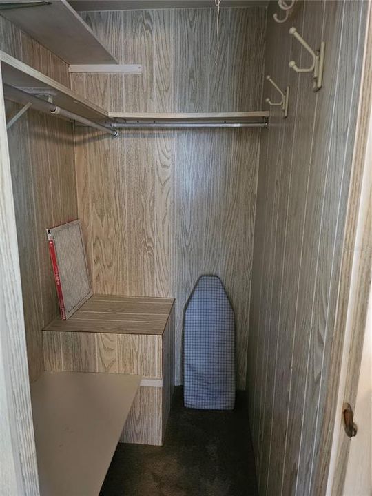 Primary bedroom walk-in closet