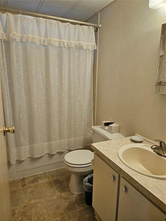 Guest bathroom with tub/shower combo