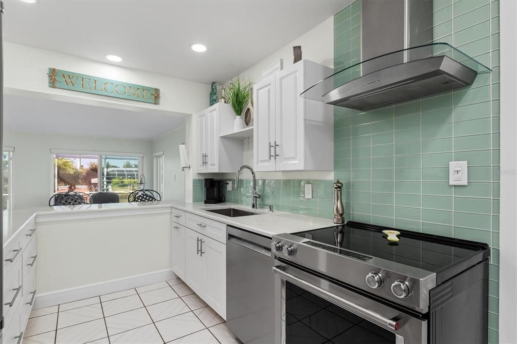 Totally updated, modern kitchen with Stainless-steel appliances, touchless faucet, quartz countertops and soft-close cabinets and drawers.