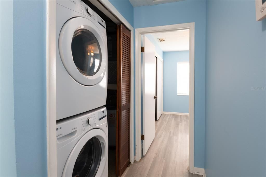 Laundry closet with storage space.