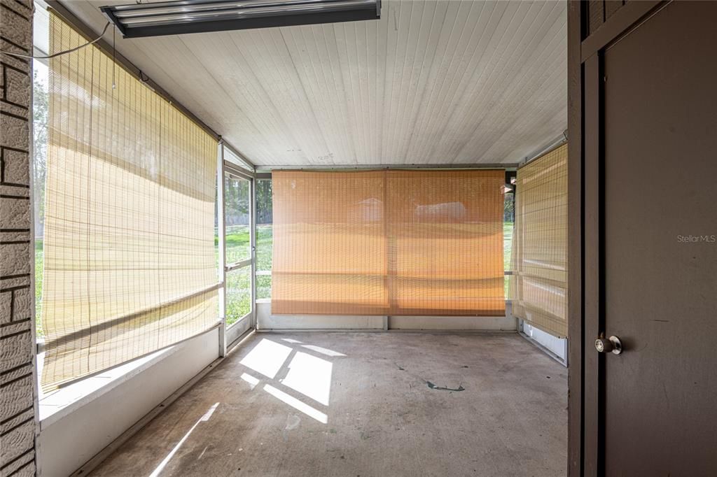 Screened lanai with storage closet.