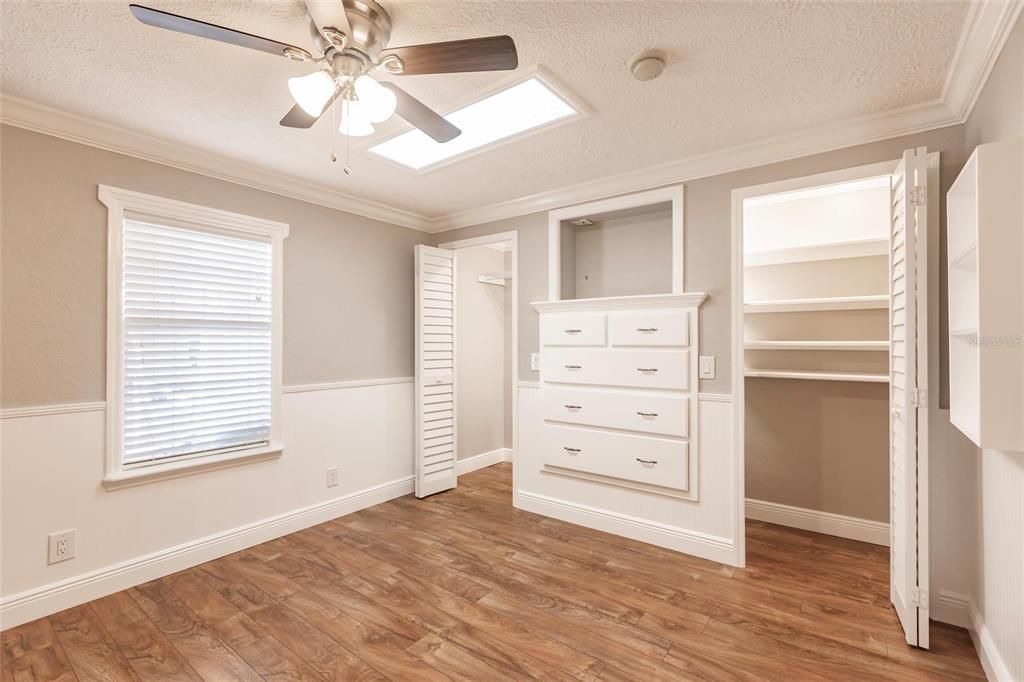 Guest bedroom, custom shelving and walk-in closets