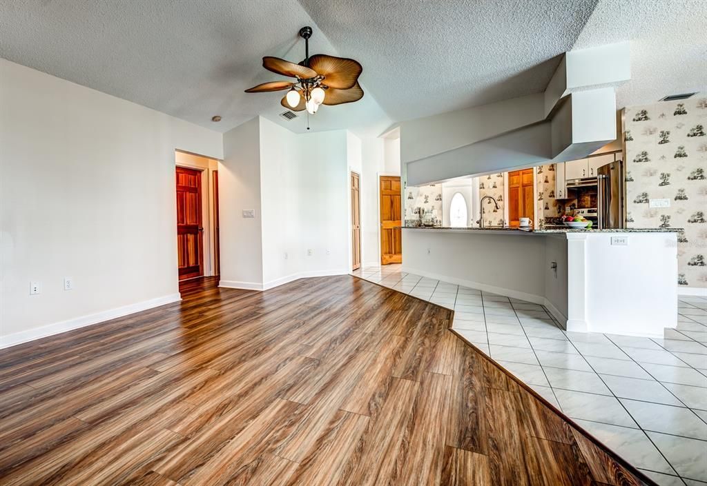 Looking toward the front foyer and bedrooms 2 & 3 and bath 2 from the spacious family room.