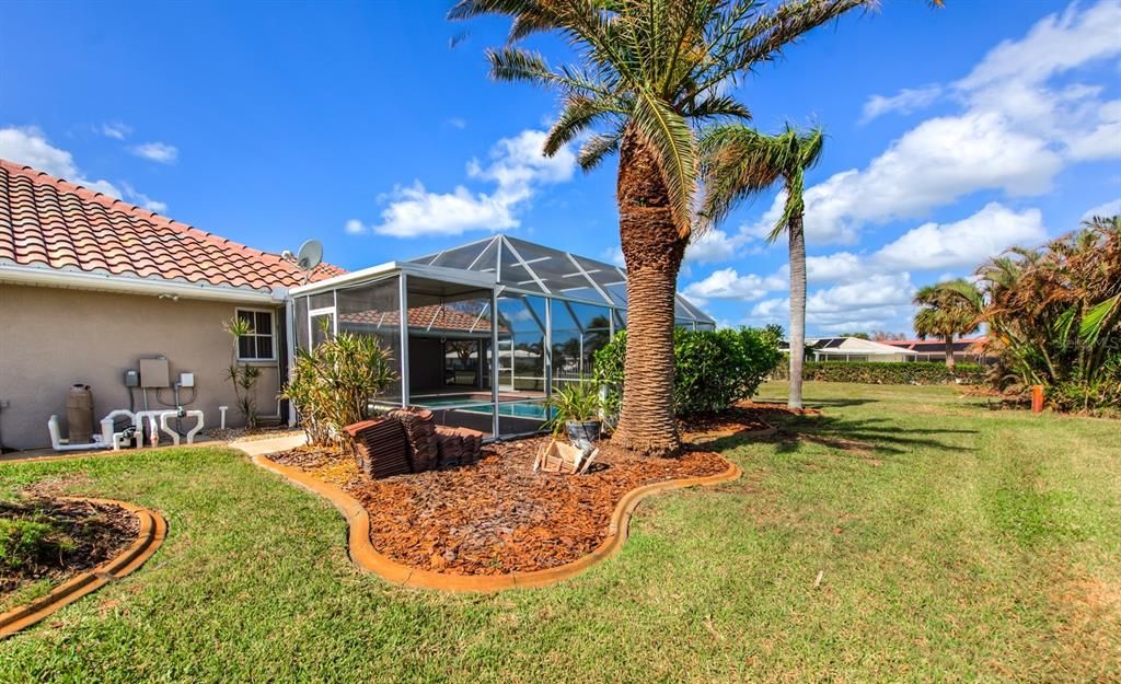 Looking into the pool area from the rear yard. Extra roof tiles remain if needed in the future.