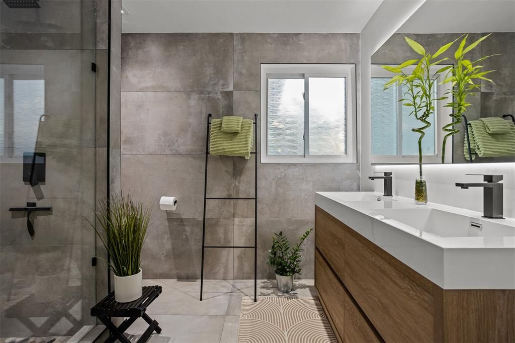 Spa-like Primary Suite with dual sinks, touch light mirrors, walk-in shower and green living