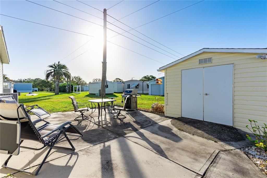 Backyard storage shed can be used for golf cart or yard equipment.