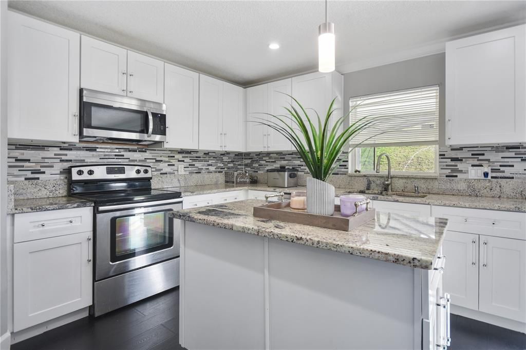 Kitchen overlooks backyard