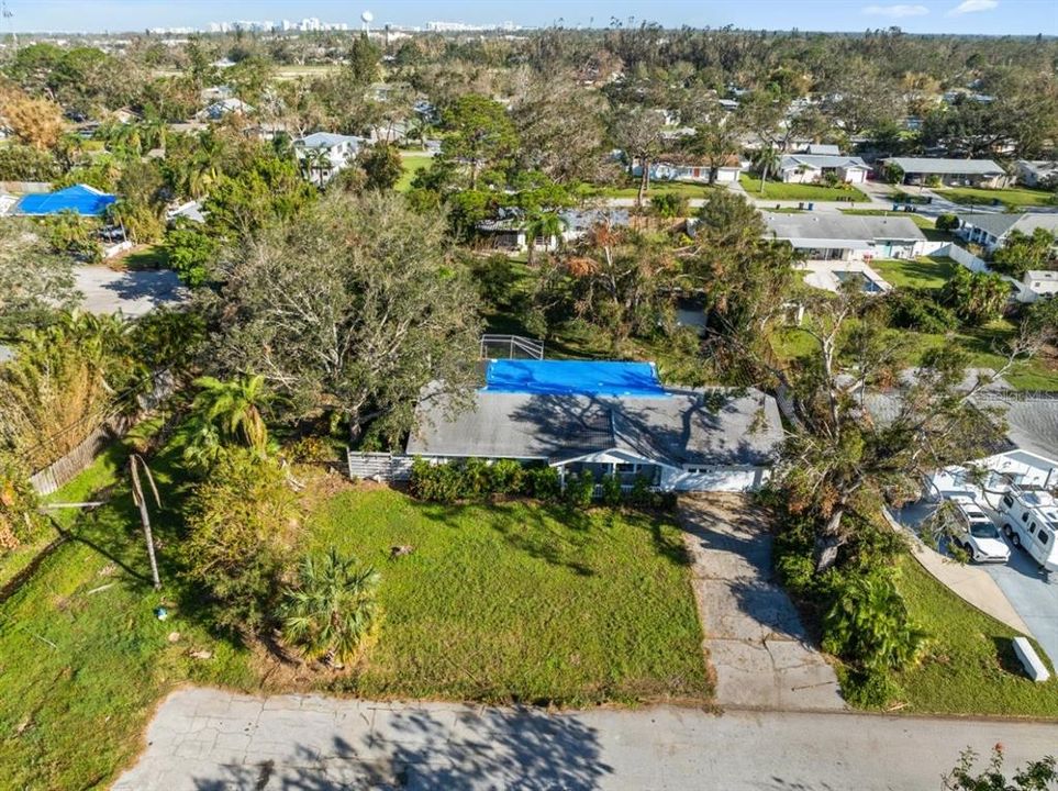 Aerial showing the front elevation of the home and the lot.