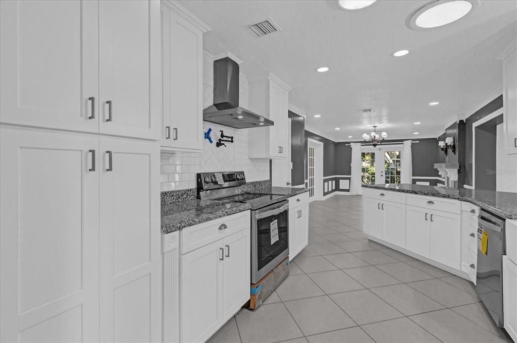 Kitchen, dining room behind photographer