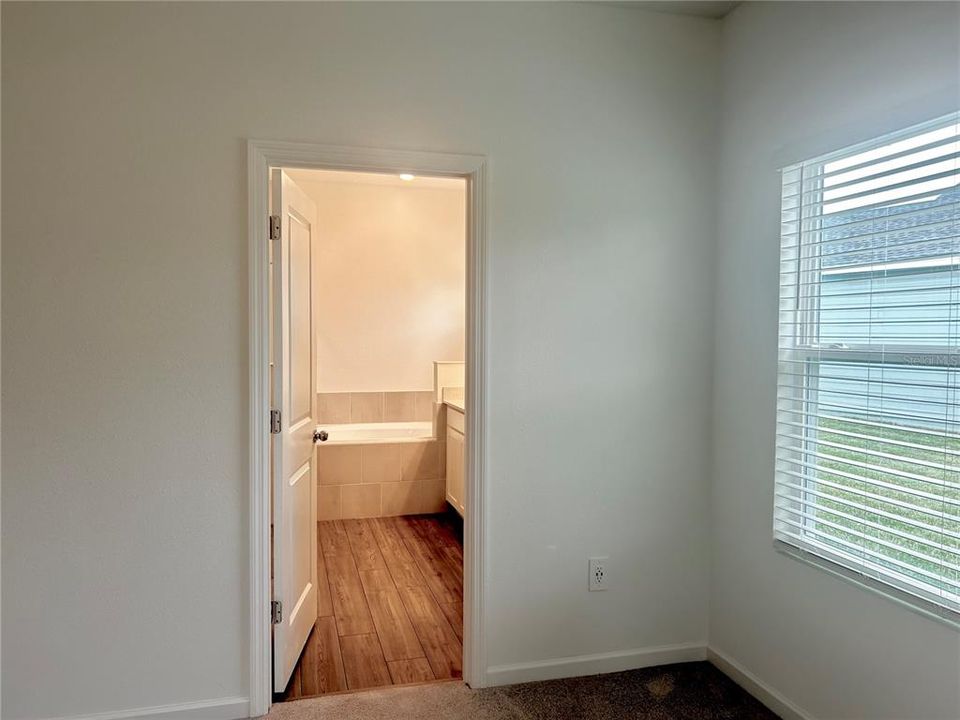 Primary Bedroom Toward Private Bathroom