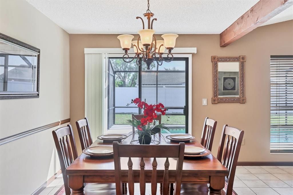 Dining Room/Looking out sliding glass doors to the Pool