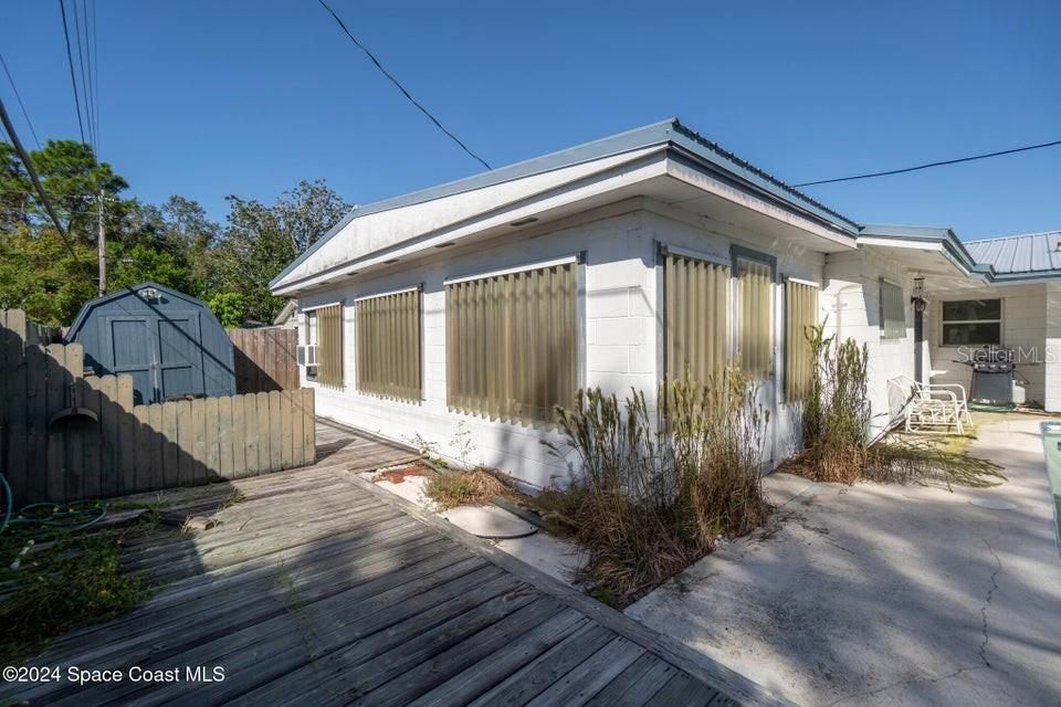 Hurricane shutters and shed come with the home.