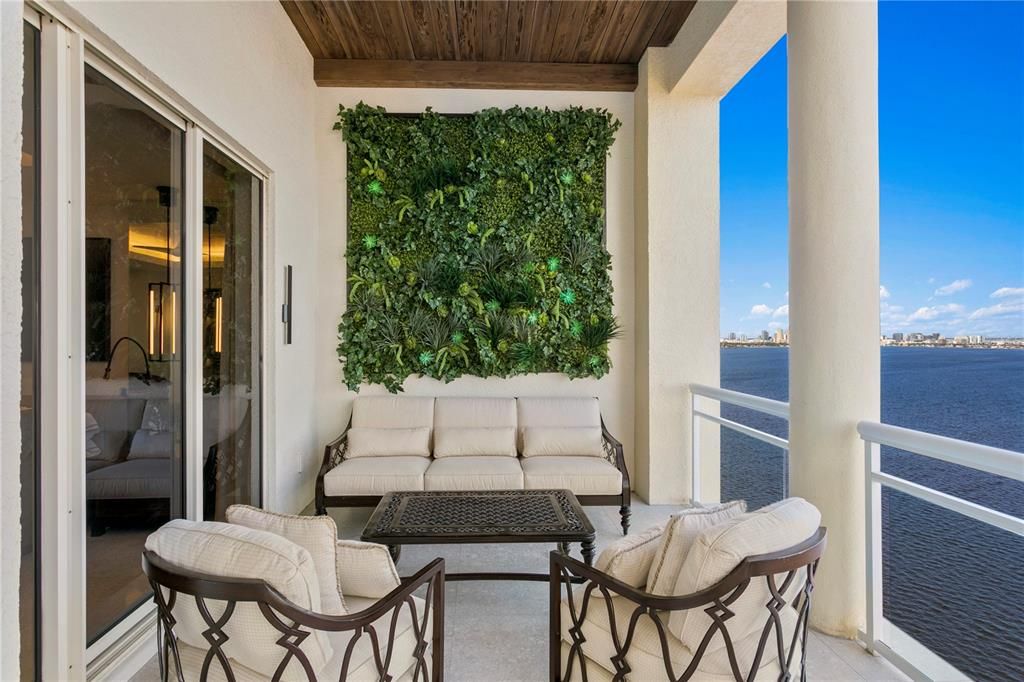 Spectacular outdoor living space with a green feature wall