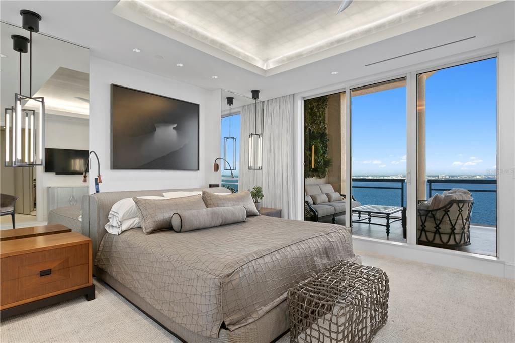 Primary Suite Bedroom with captivating water views