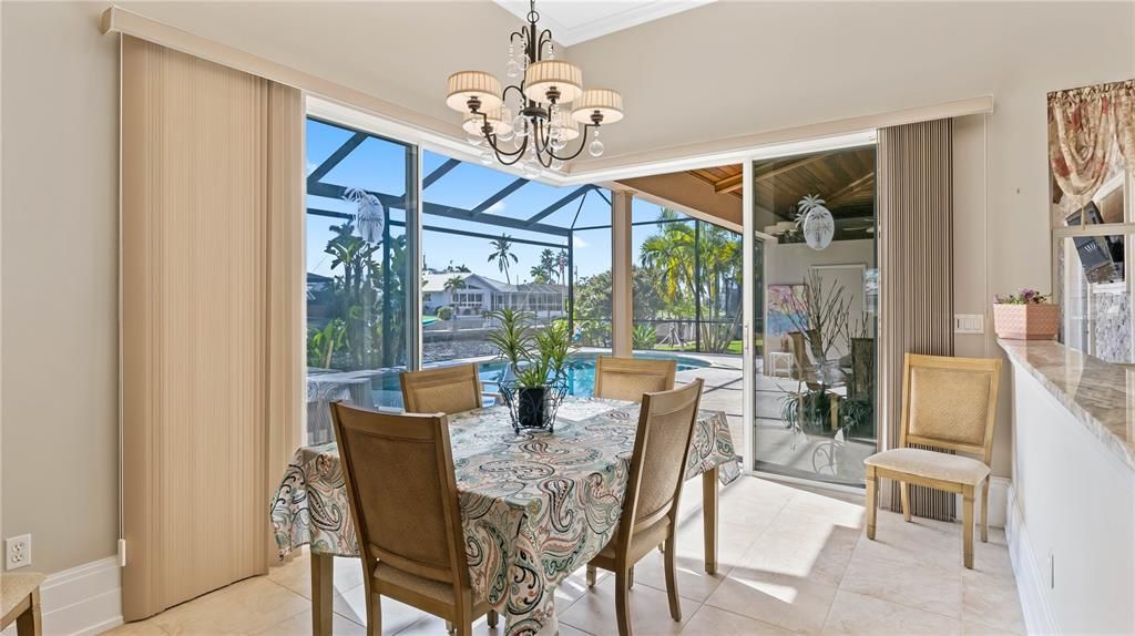 Dining room is located off the kitchen and can easily accommodate a large table - the glass doors are 90 degree sliders and can be opened to extend the living area - this home really offers so much for entertaining reasons! Kick back with friends and family and enjoy the good life!