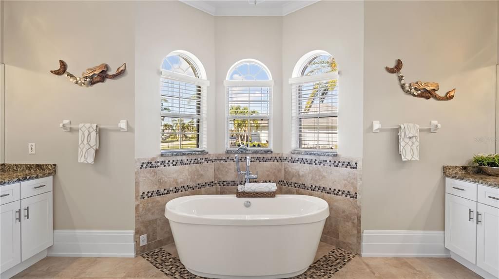 Soak all your troubles away in this deep soaking tub! Large separate walk in shower and his and hers dual vanities!