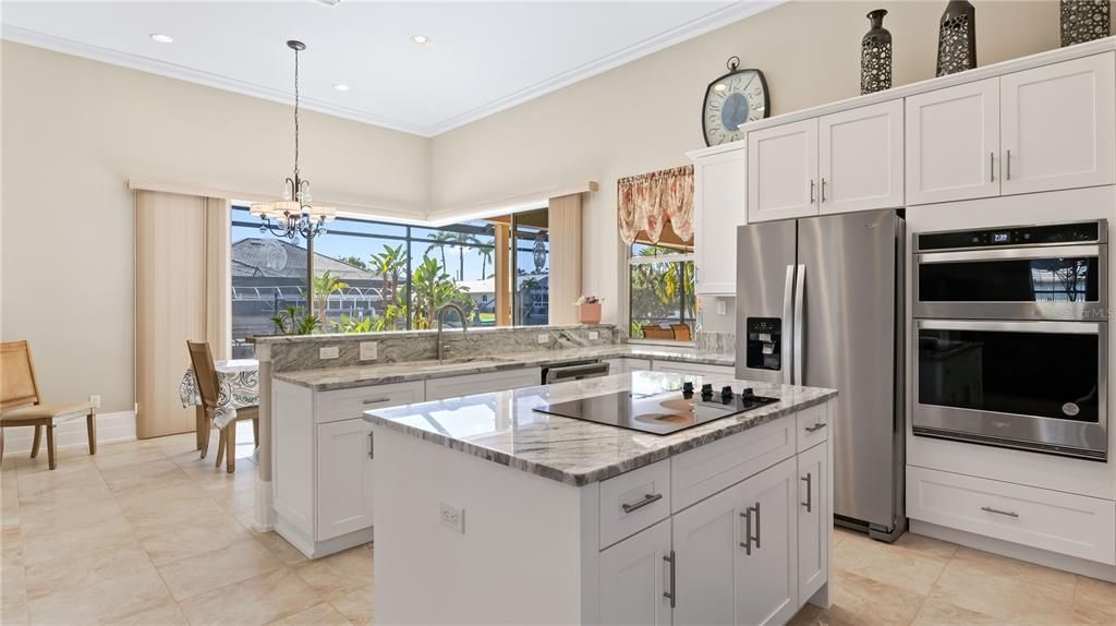 There are kitchens and then there are KITCHENS! This sprawling kitchen was just remodeled with brand new cabinets and appliancces and in addition to the large kitchen island, it also contains an additional island - double the islands, double the space for entertaining! Beautiful countertops add to the soothing neutral paint palette. There is also tons of space including a large walk in pantry with plenty of room for large appliances.