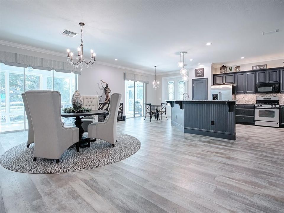 EASY ACCESS TO THE OPEN KITCHEN. SLATE GRAY CABINETRY COMPLIMENTS THE STAINLESS APPLIANCES.