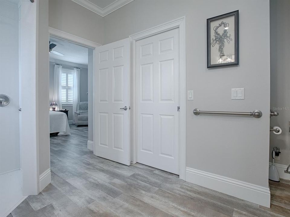 POCKET DOOR LEADS TO LARGE WALK-IN CLOSET.