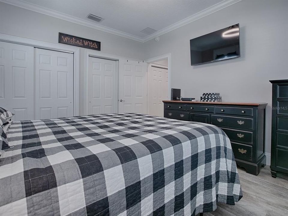 2 SETS OF DOUBLE SLIDING CLOSET DOORS FOR LOTS OF CLOSET SPACE. WALL MOUNTED TV REMAINS WITH THE HOME.