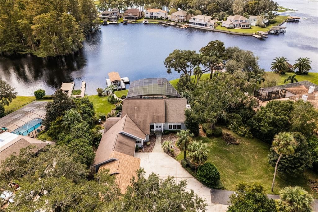 Aerial view of the front of the house and the lake.