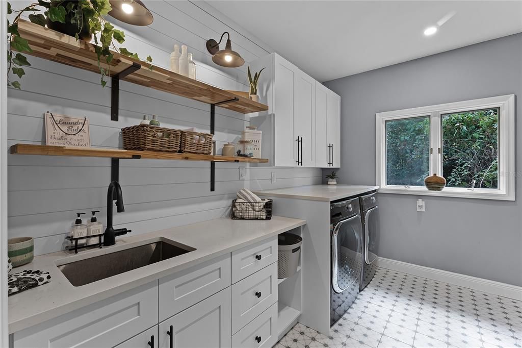 View of the laundry room featuring the sink and washer/dryer.