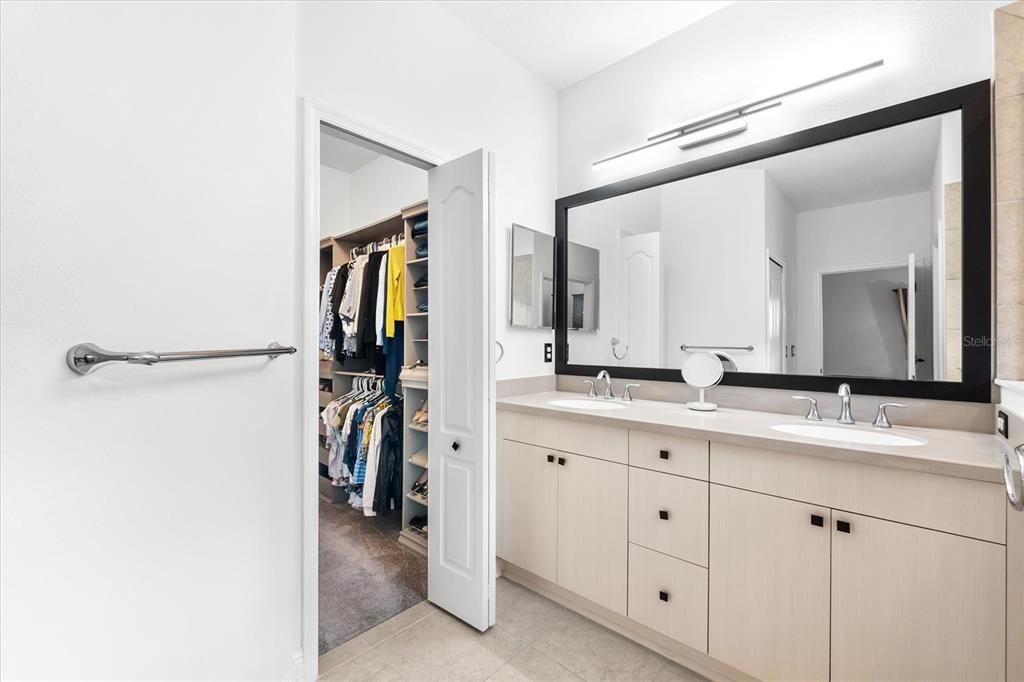 Walk-in closet with built-ins in the primary bathroom