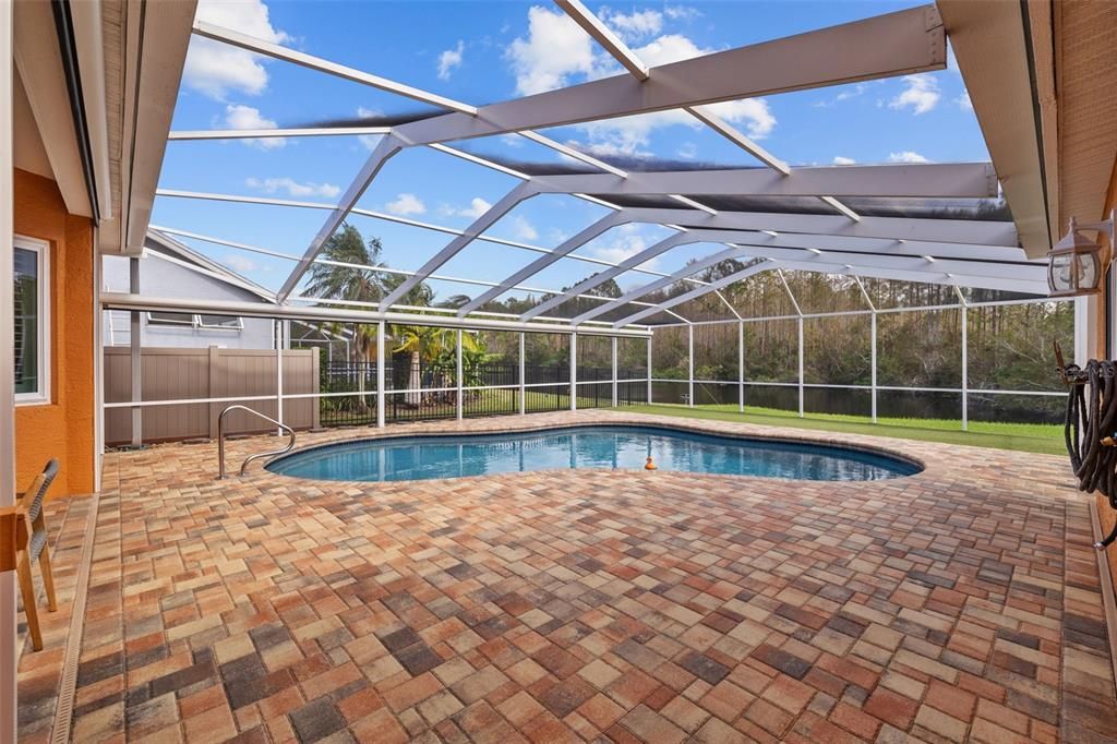 Freshly sealed paver pool deck