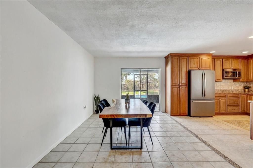 Dining room with sliders out to the lanai and pool